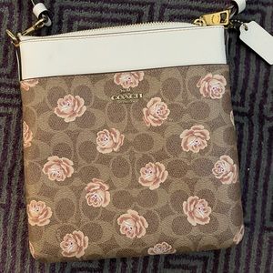 Coach Signature Roses cross-body bag.